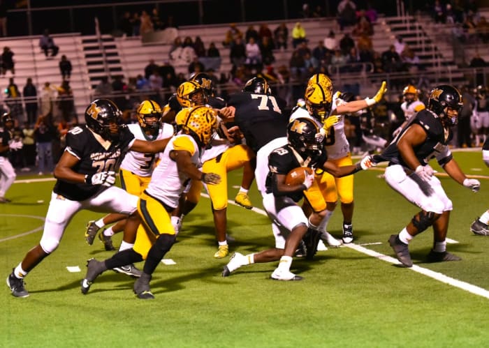 Midwest City senior tailback Lasiera Laviolette (with ball) helped the Bombers to a 42-7 win against previously undefeated Lawton MacArthur on Oct. 13, 2023.